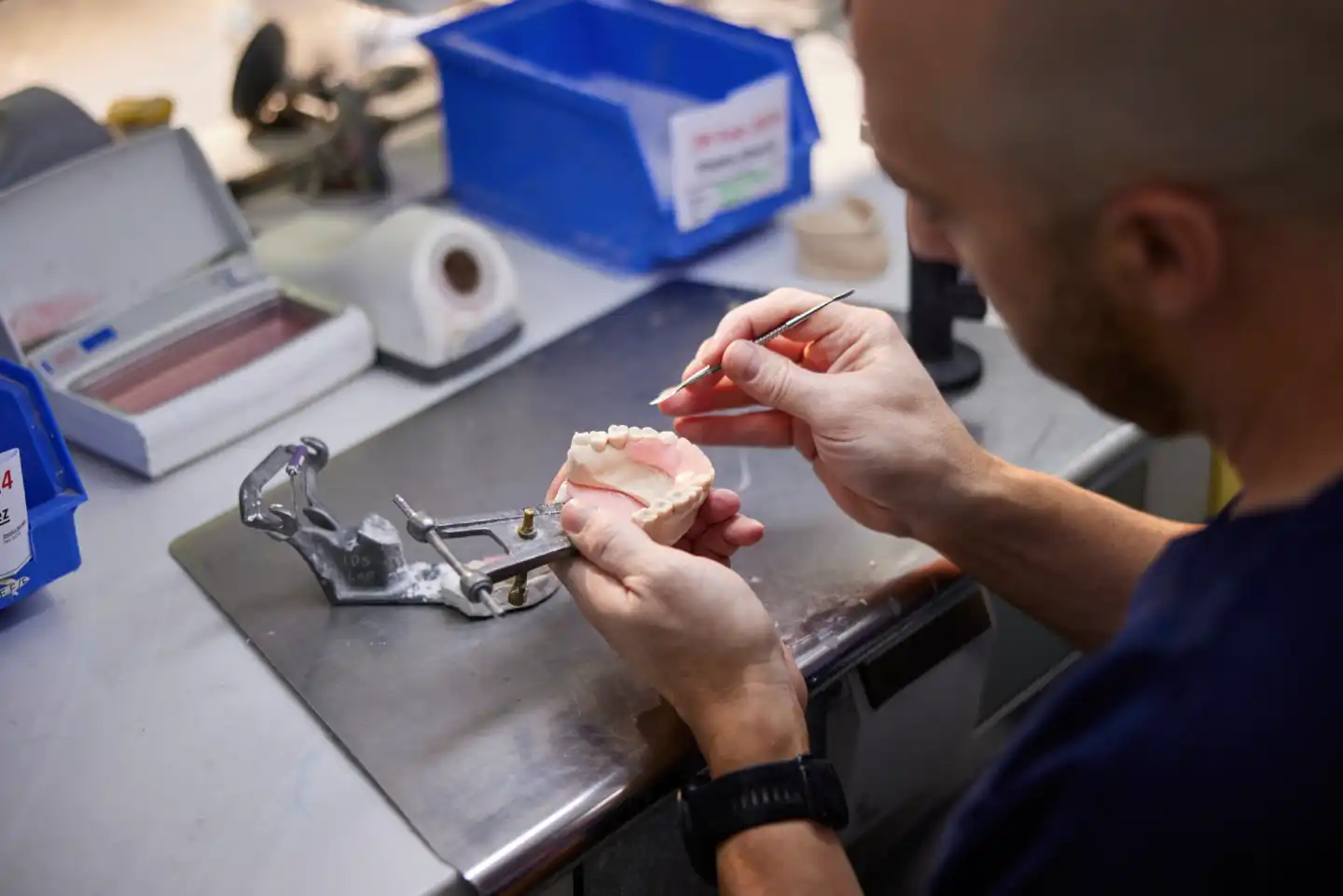 a man crafting dentures